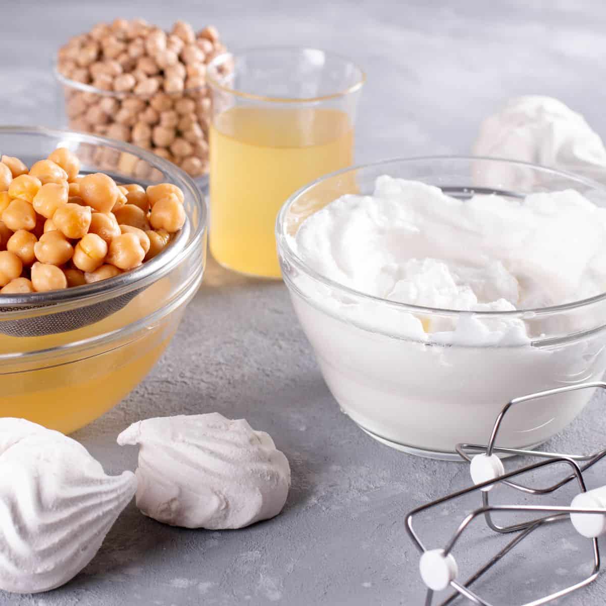 Bowl of whipped aquafaba and chickpeas.