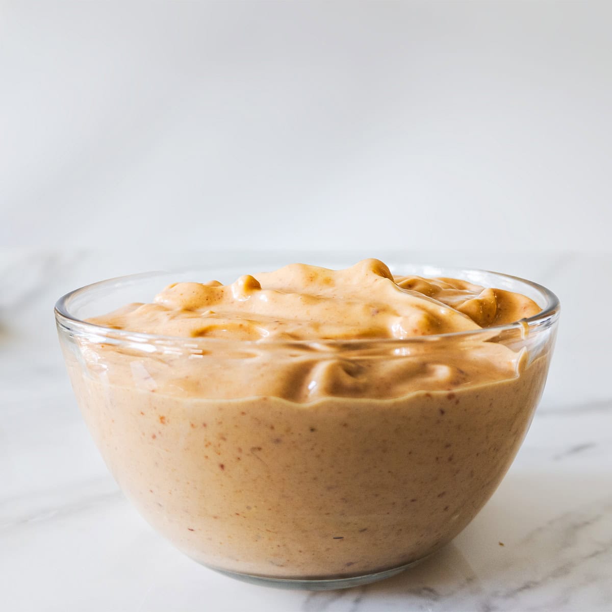 Vegan chipotle mayo in a dish.