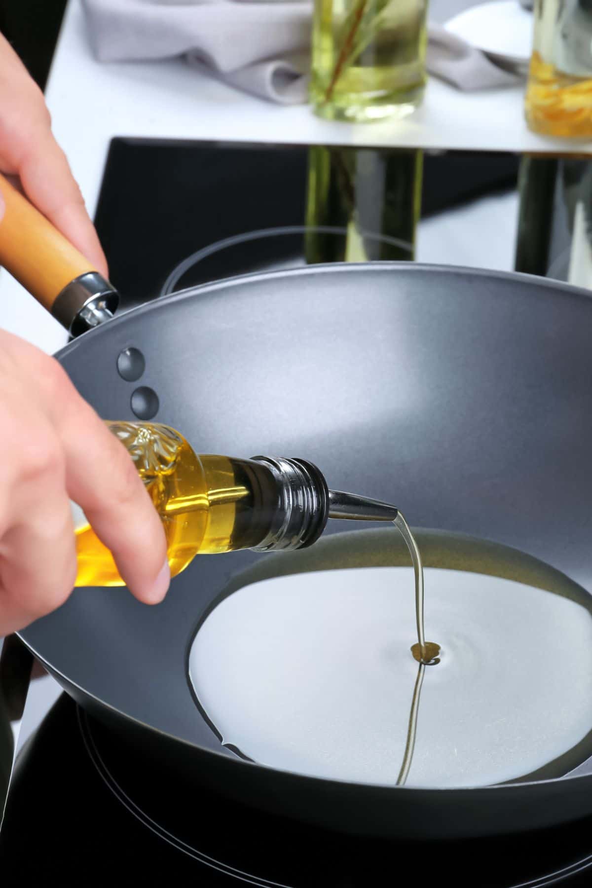 pouring oil into a wok